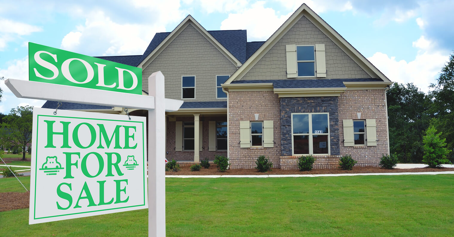 home with a "for sale" sign in the front that was marked sold