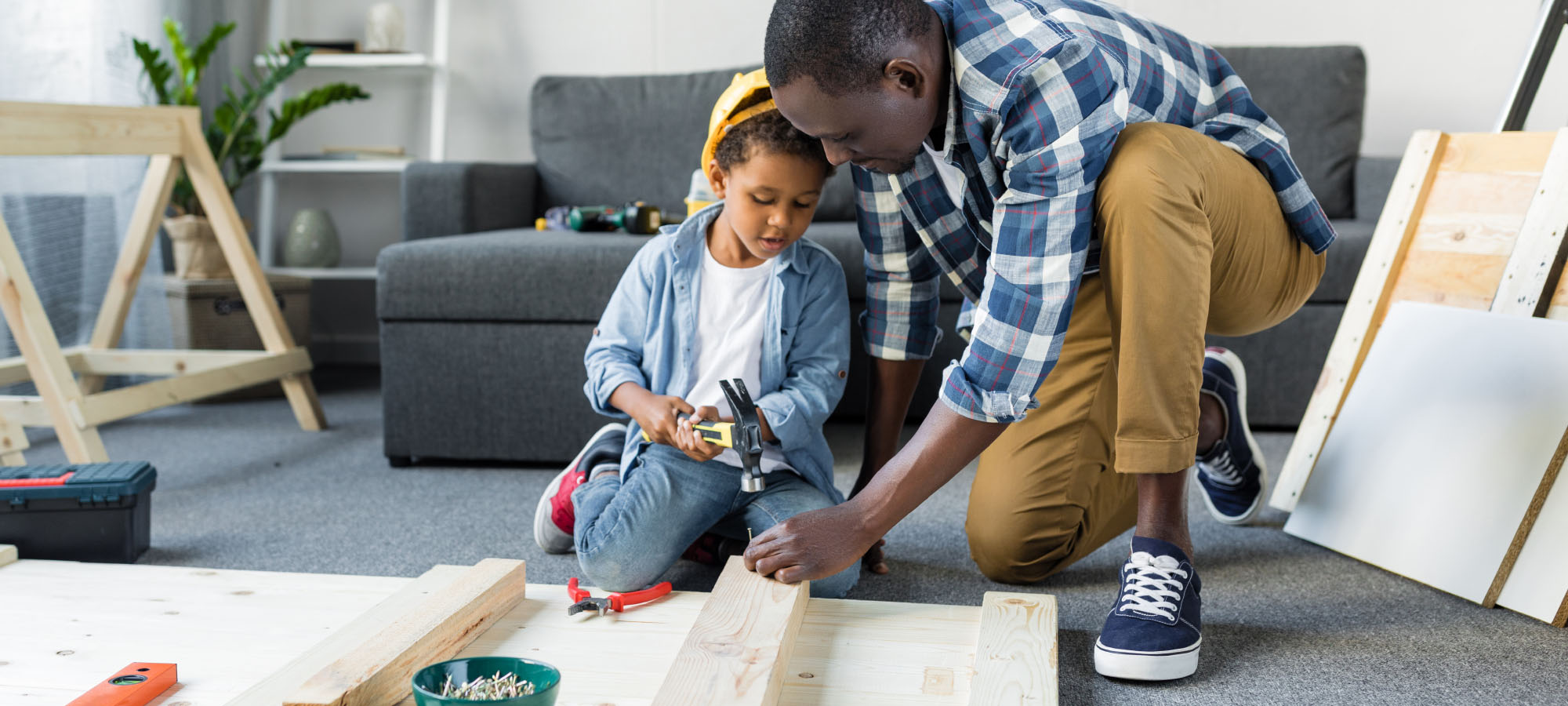 father and son building a project from wood