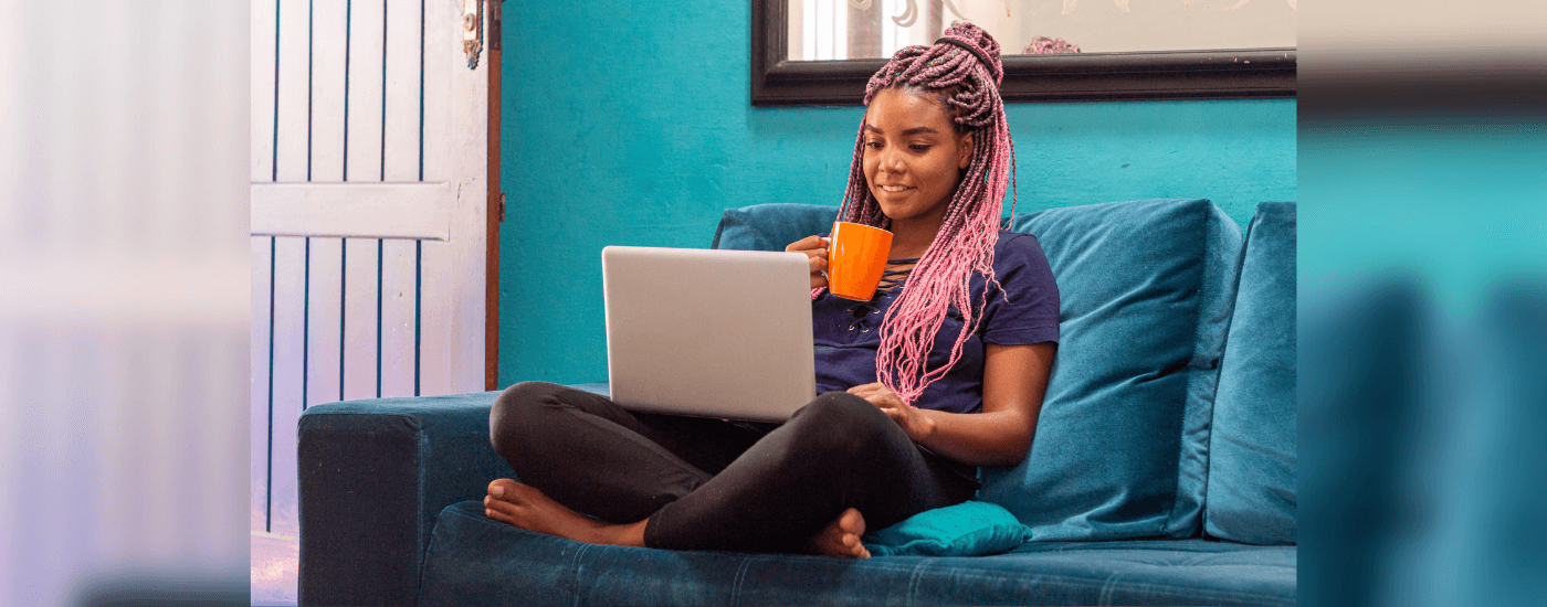 homeowner sitting on the couch and working remotely