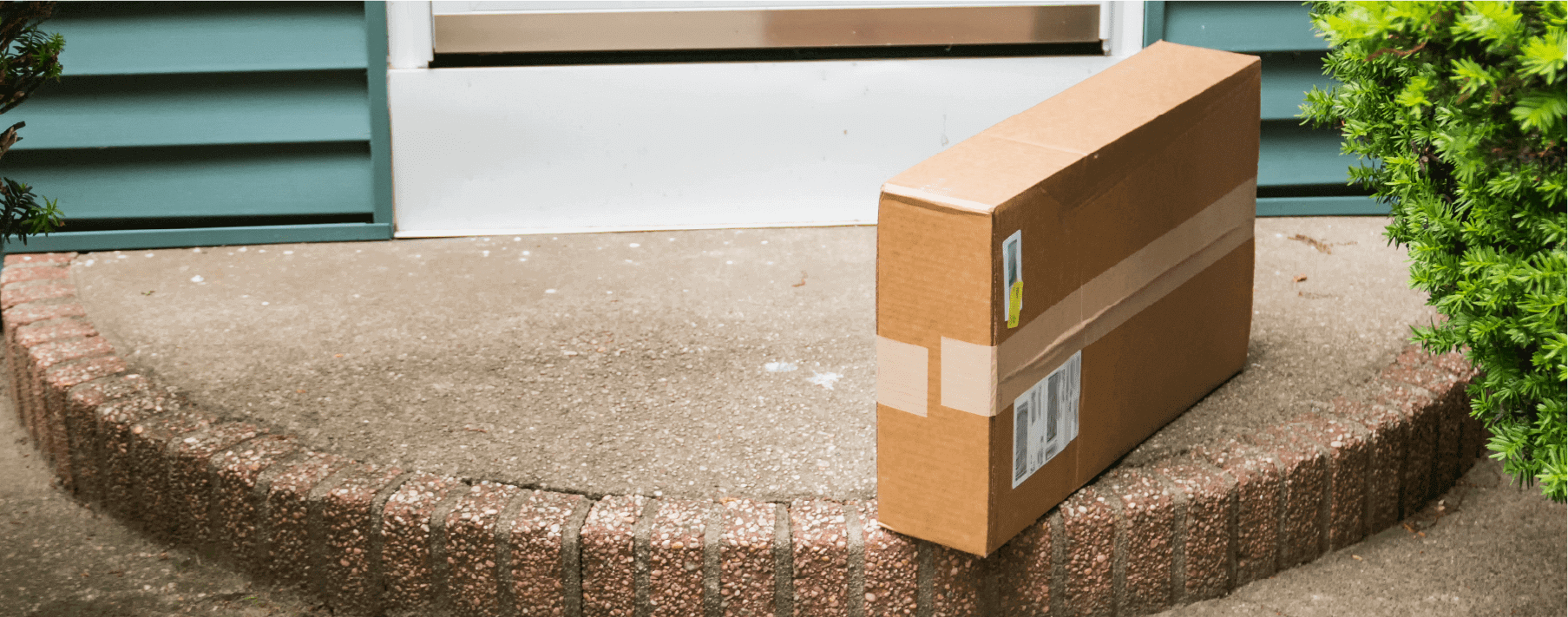 A delivery box left on by the front door of a home