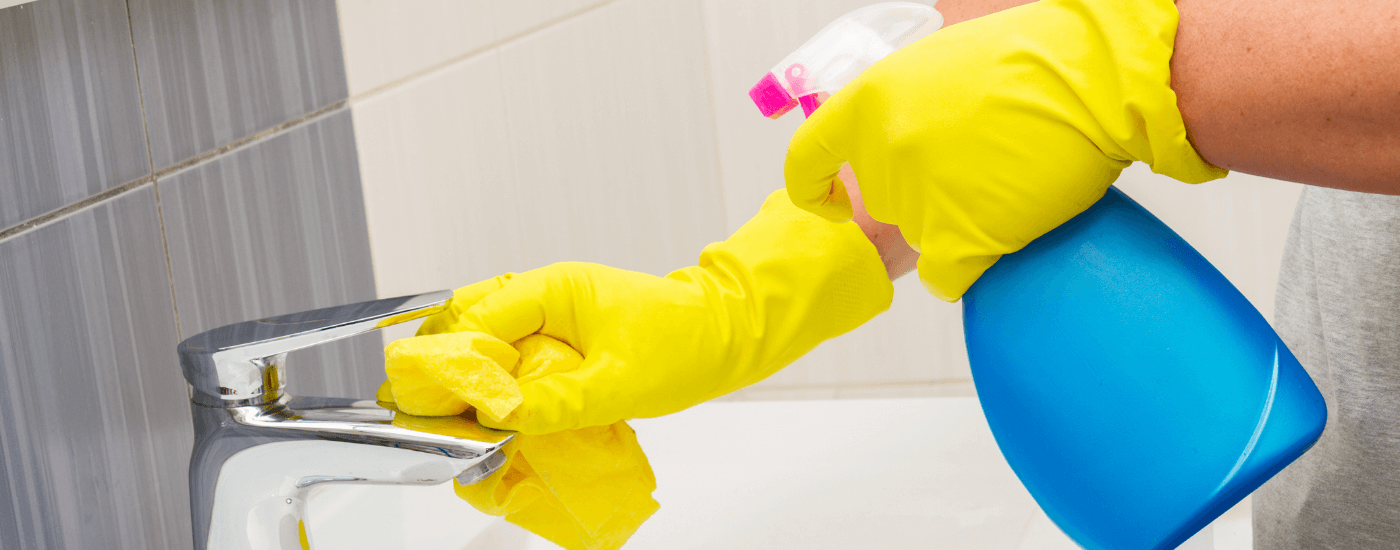 homeowner spring cleaning their bathroom sink