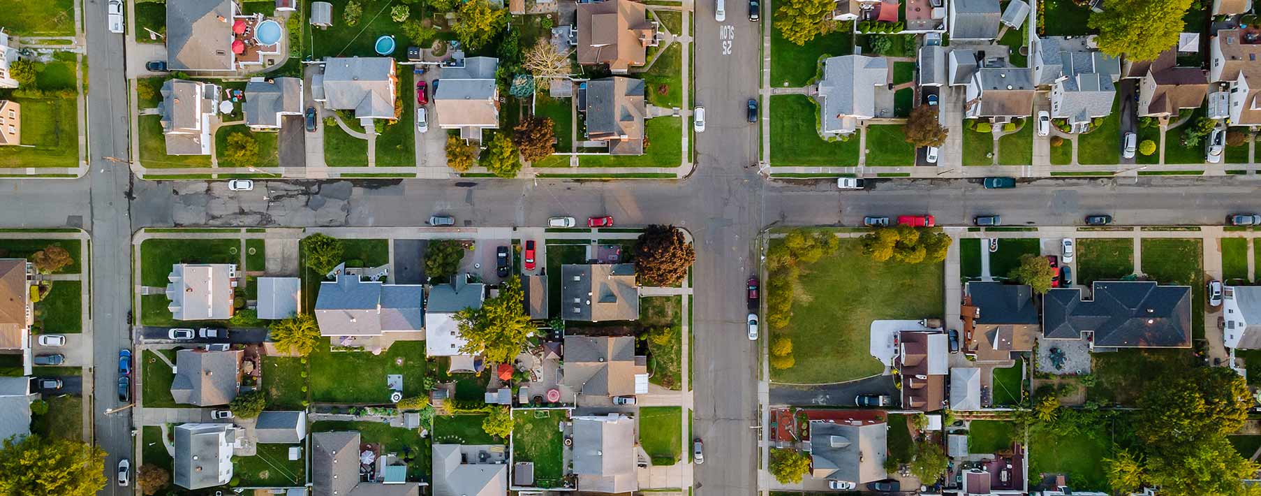 An aerial view of a suburban street.