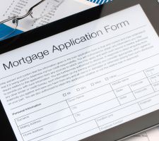 A tablet showing a mortgage application form