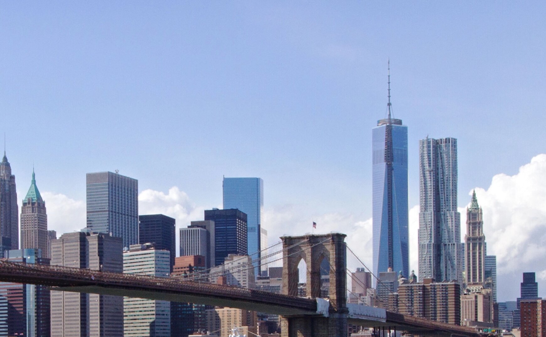 Image of buildings in New York City with a bridge