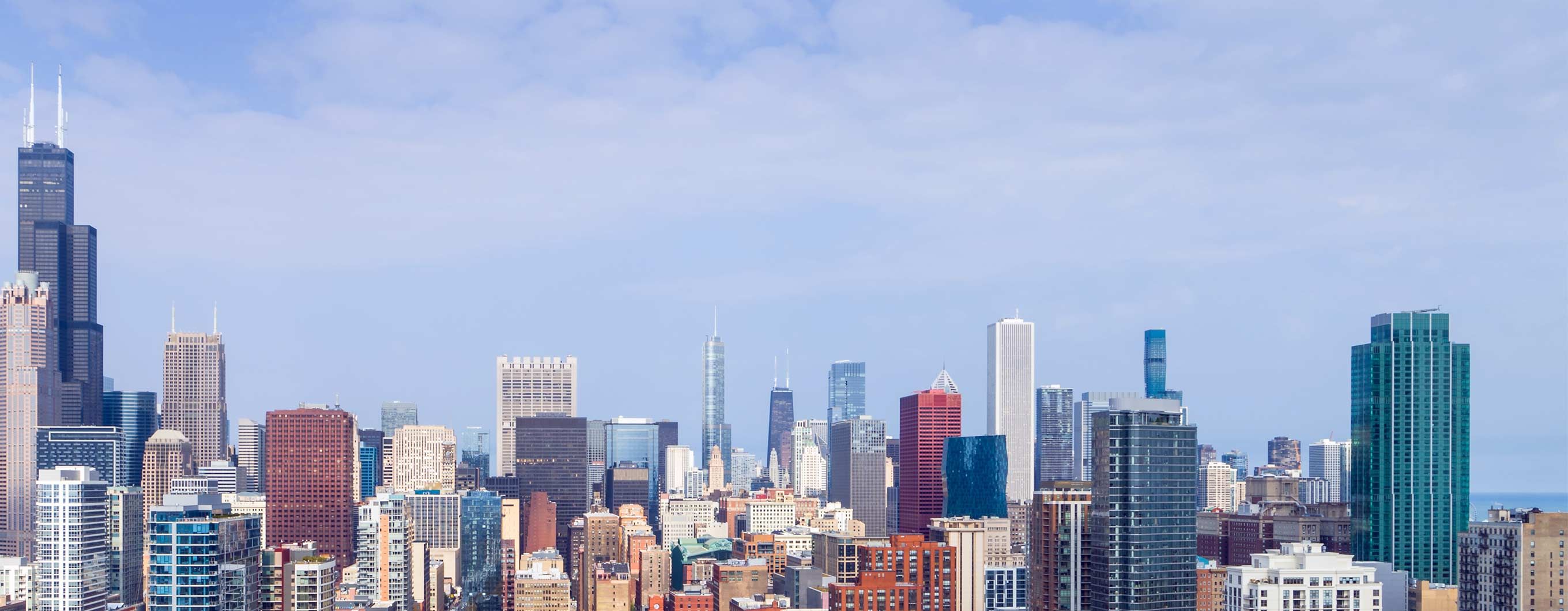 Chicago skyline with clouds and a blue sky