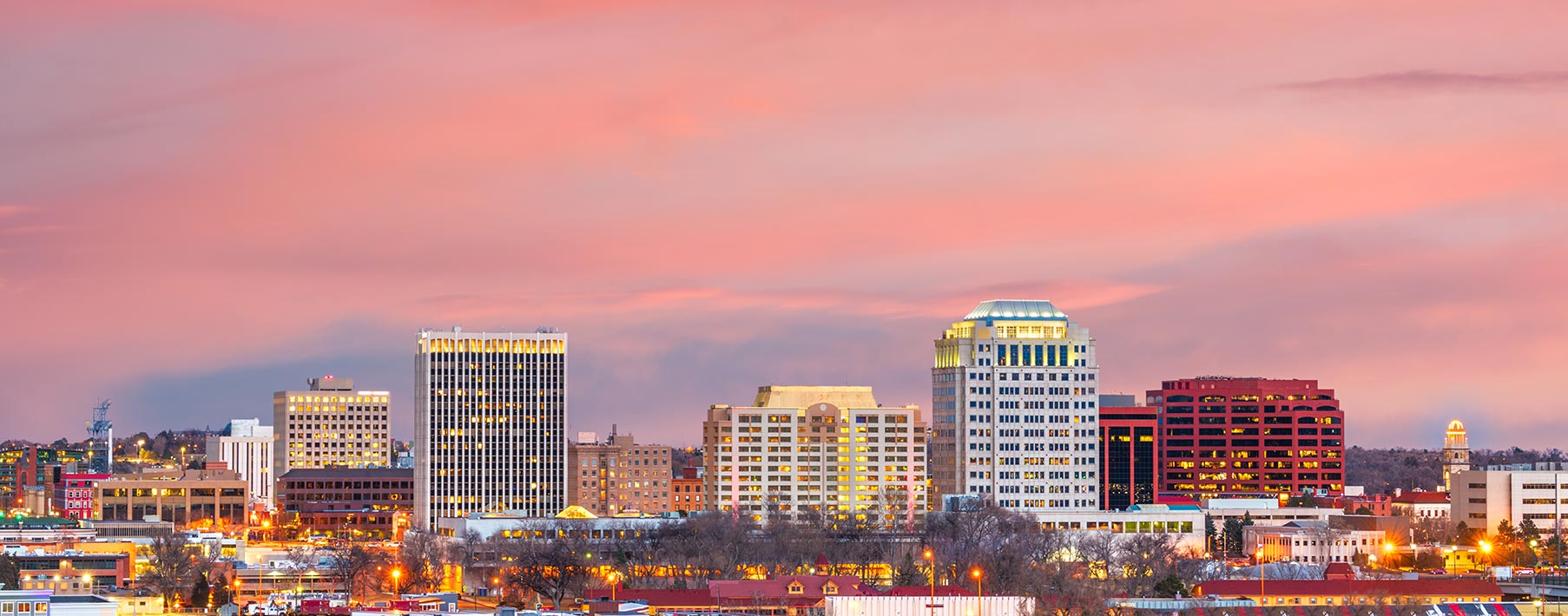 Image of the Colorado Springs skyline with pink clouds above