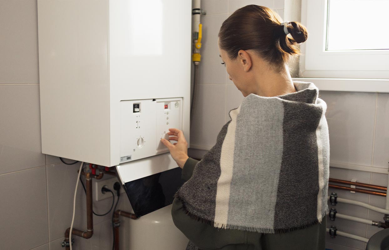 homeowner checking their heater