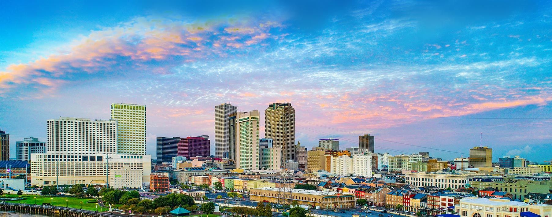 Image of a city in Louisiana near the water, with a big boat in the water