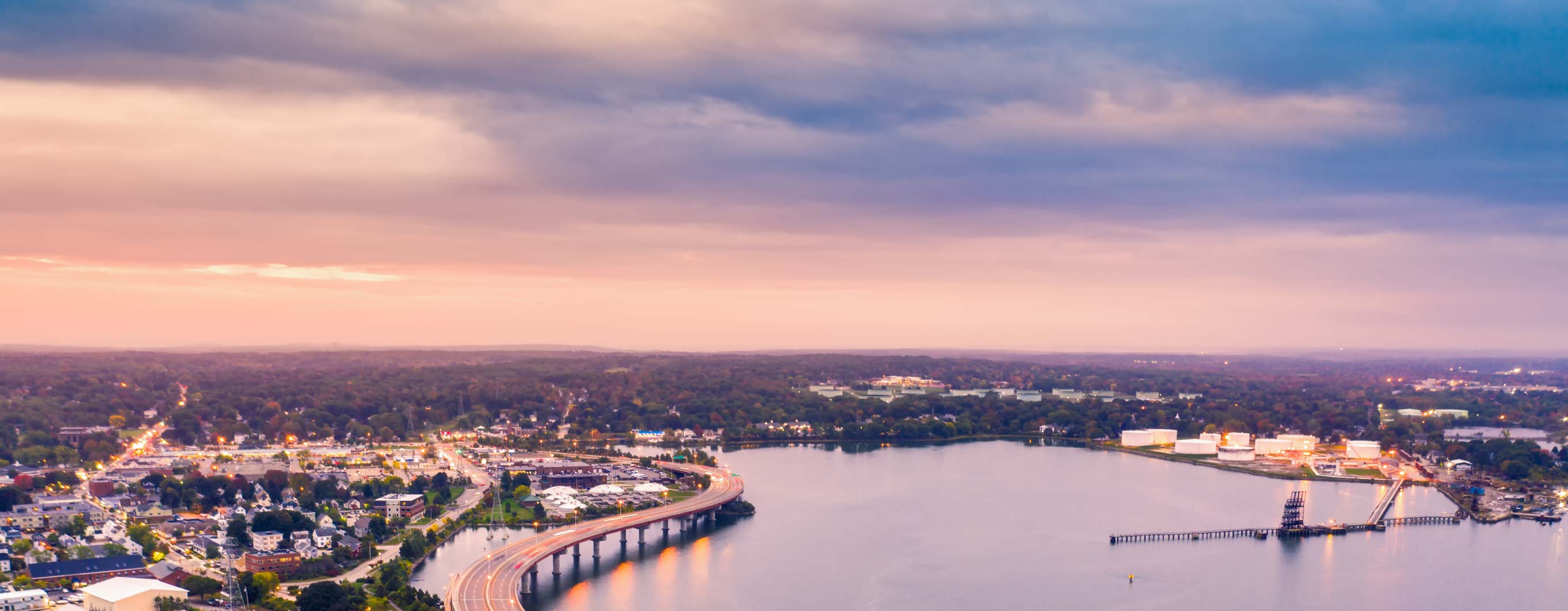 A body of water at sunset.