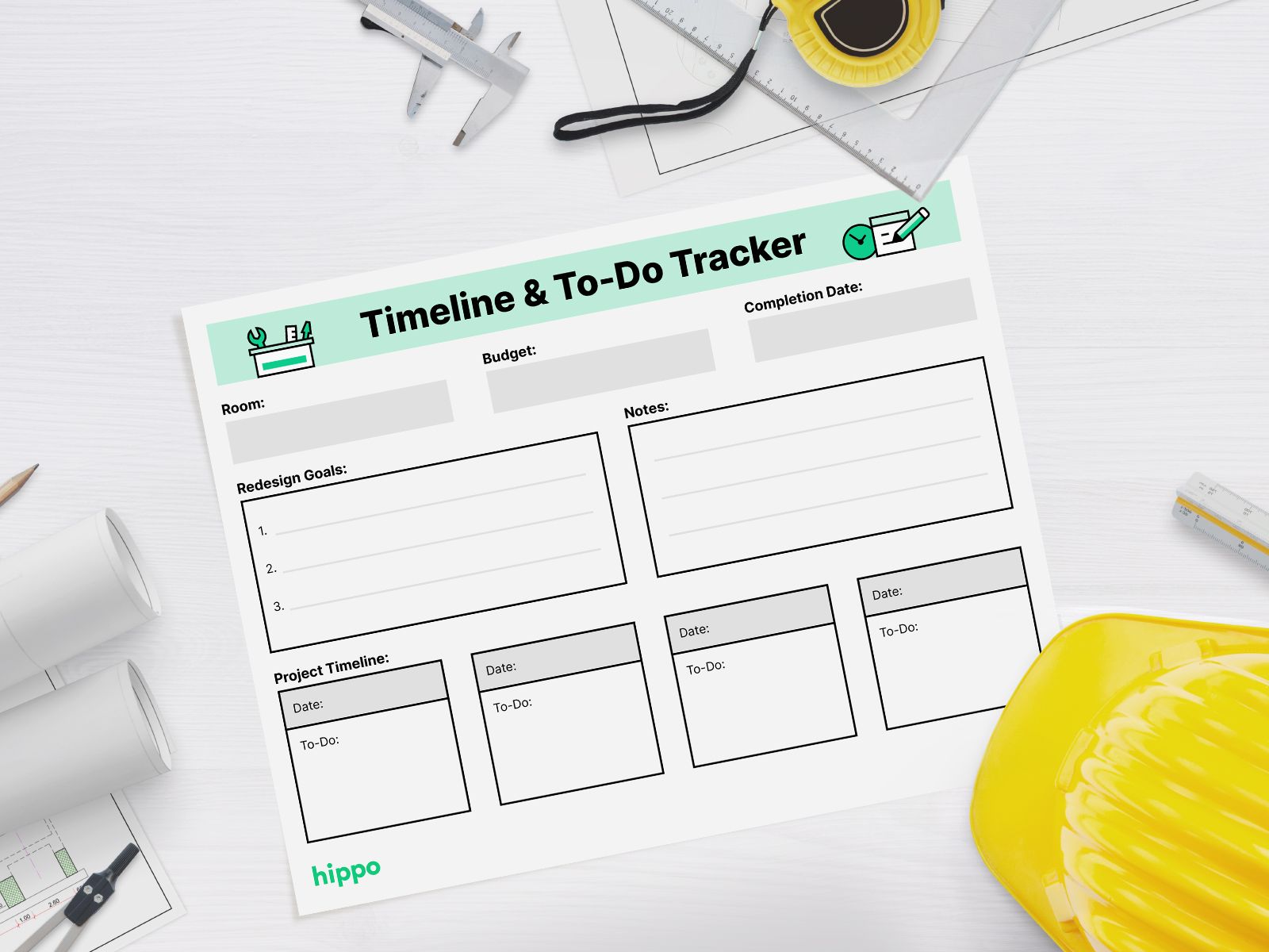 Timeline tracker on a desk near a hard hat and tools