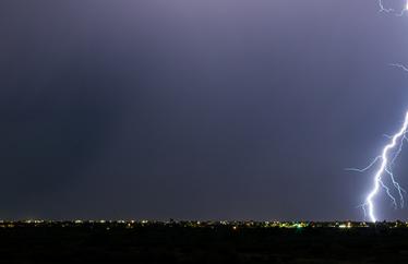lightning strike above a city
