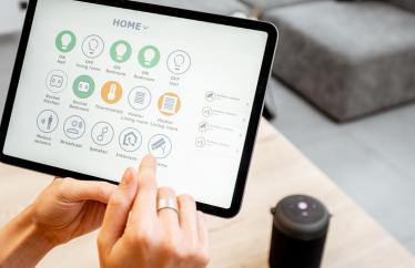 Someone using a smart home tablet