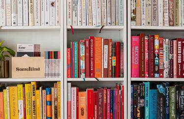 Image of colorful books on a white bookshelf