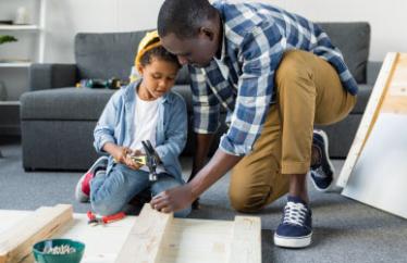 father and son building a project from wood