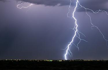 lightning strike above a city